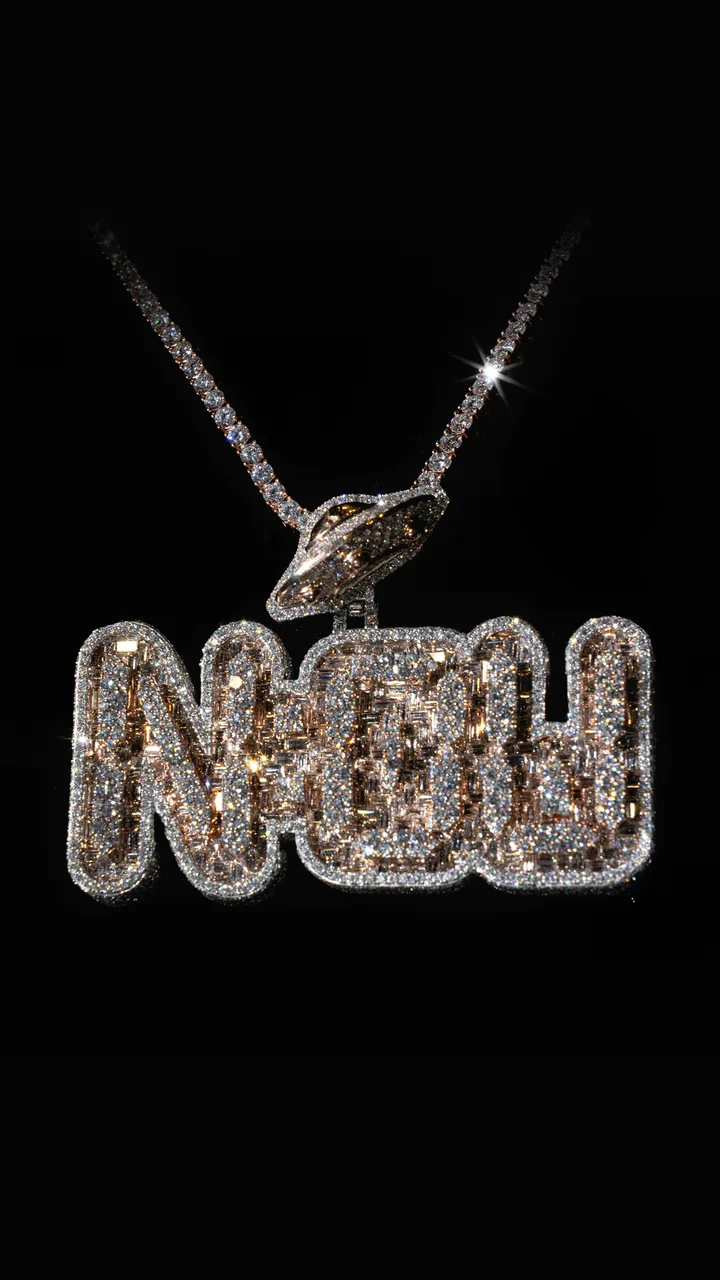 A Royal T custom stone-set lettering pendant on a tennis chain