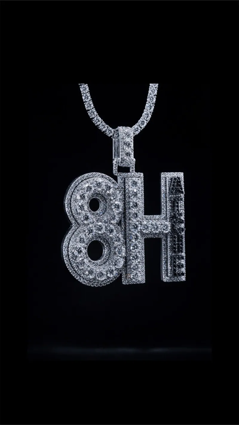 Stone-set 8H initials pendant on a tennis chain