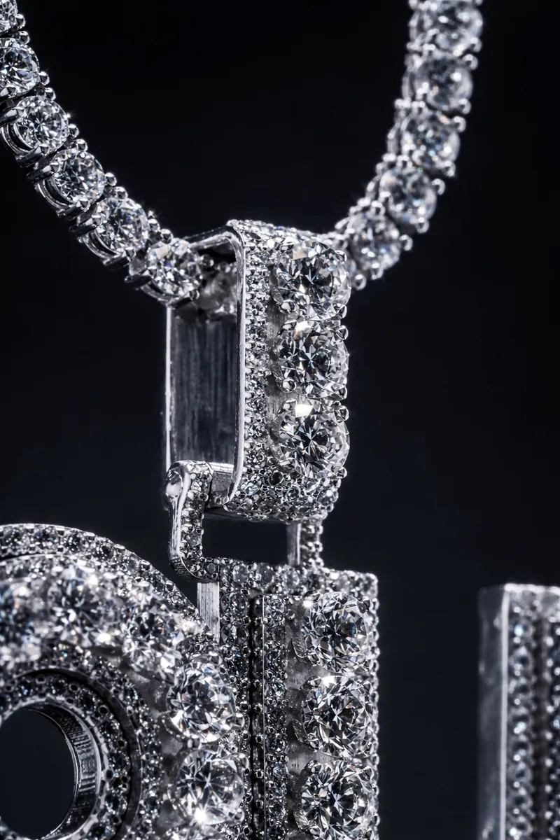 Close-up of the 8H pendant's bail and baguette-set stones