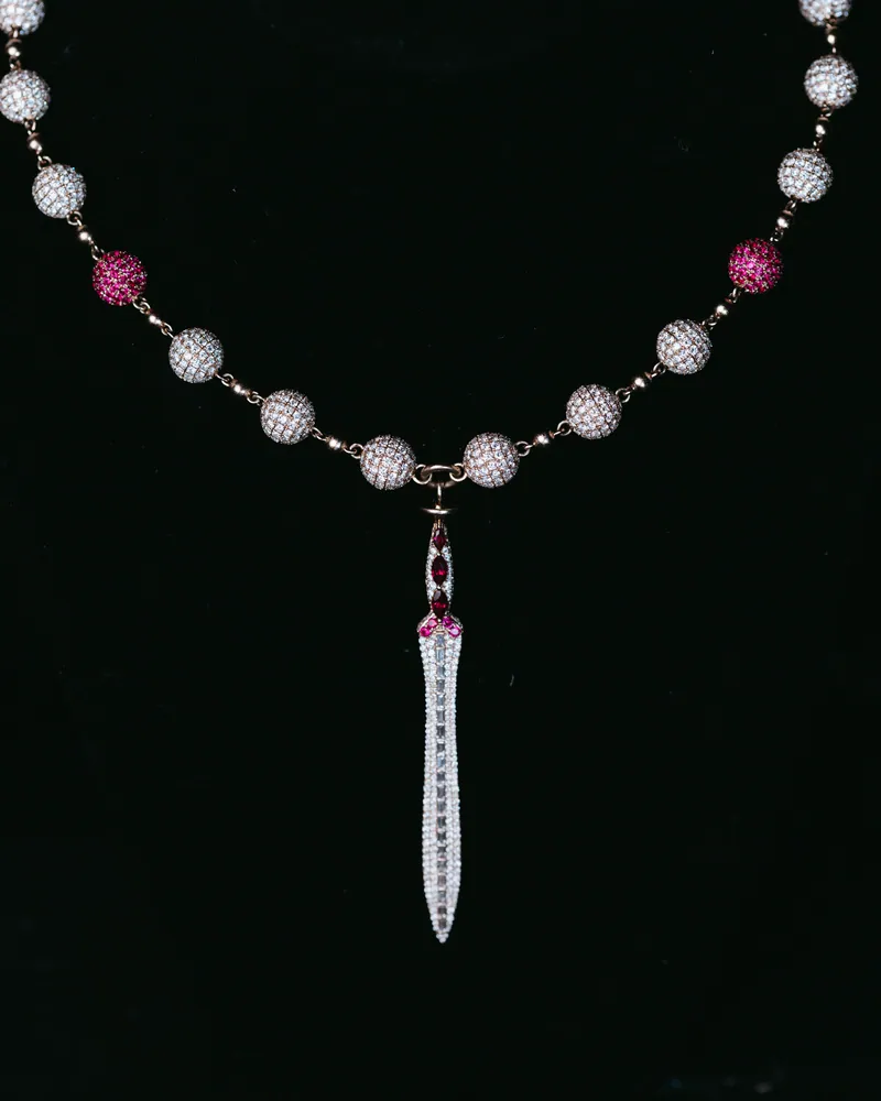 Stone-set blade pendant on a bead necklace with pink accent beads