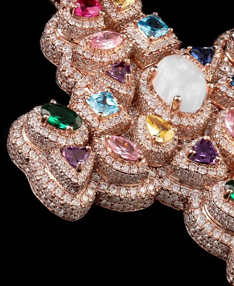Rose-gold pendant set with multicolor stones, close-up
