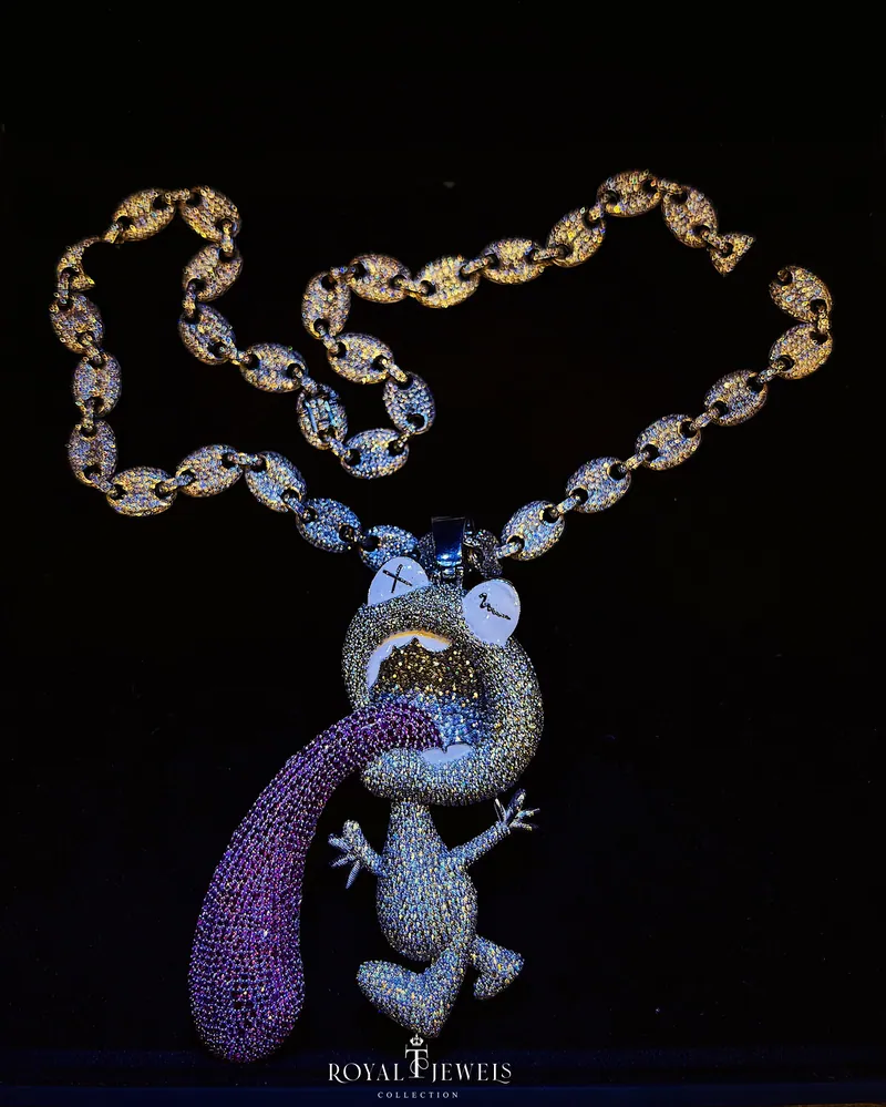 Stone-set cartoon character pendant with a purple tongue on a puffed mariner-link chain